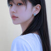 Orange earring on it