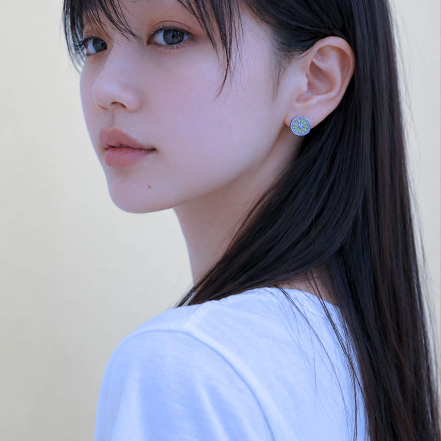 Orange earring on it