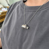WearingMeatNecklaceSideView