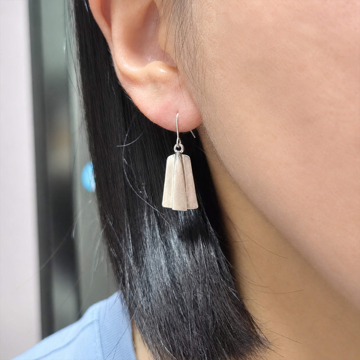 WearingPaviseShieldEarring2